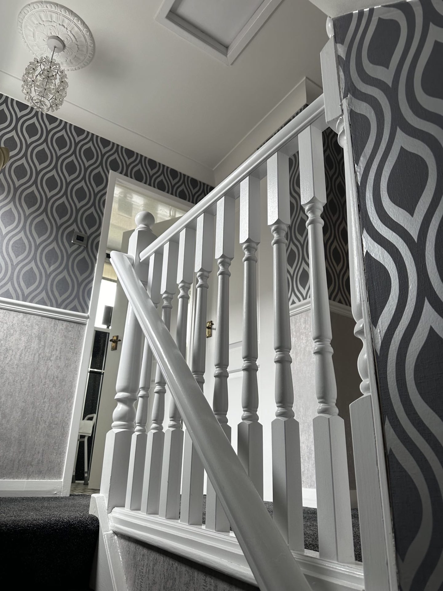 Crisp white gloss on stair spindles and banister